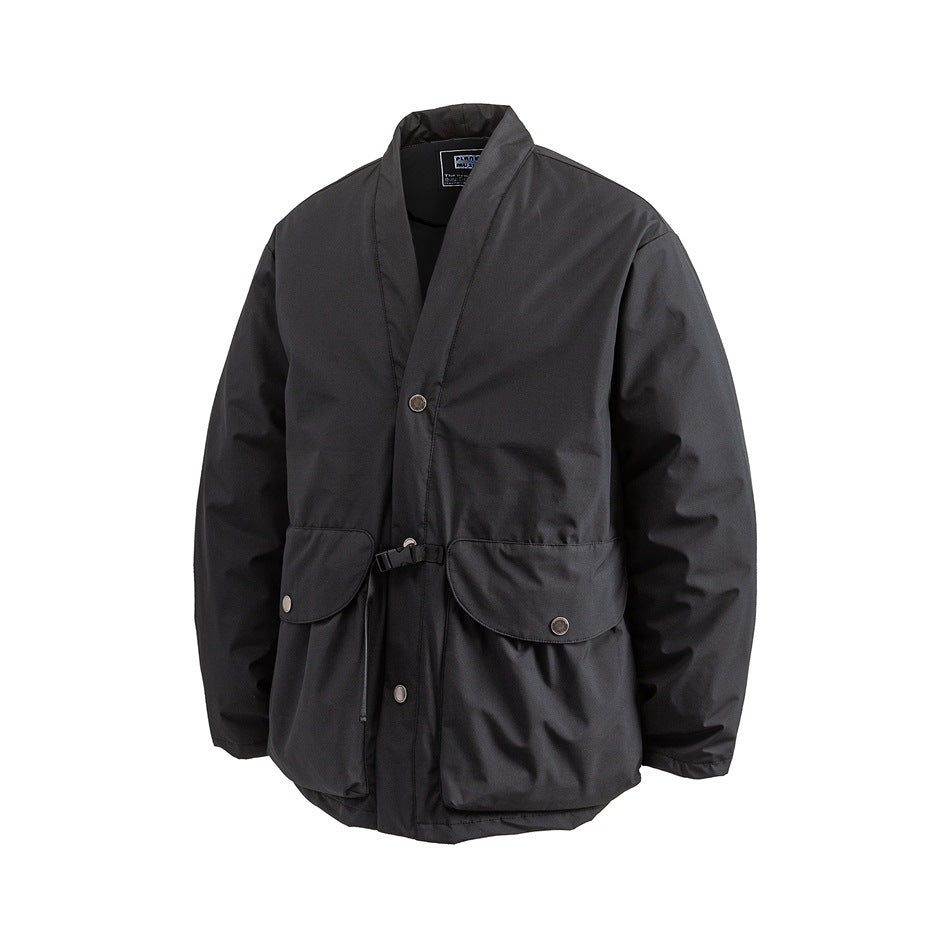 Black padded kimono-style jacket at a three-quarter angle showing snaps, flap pockets and buckle strap