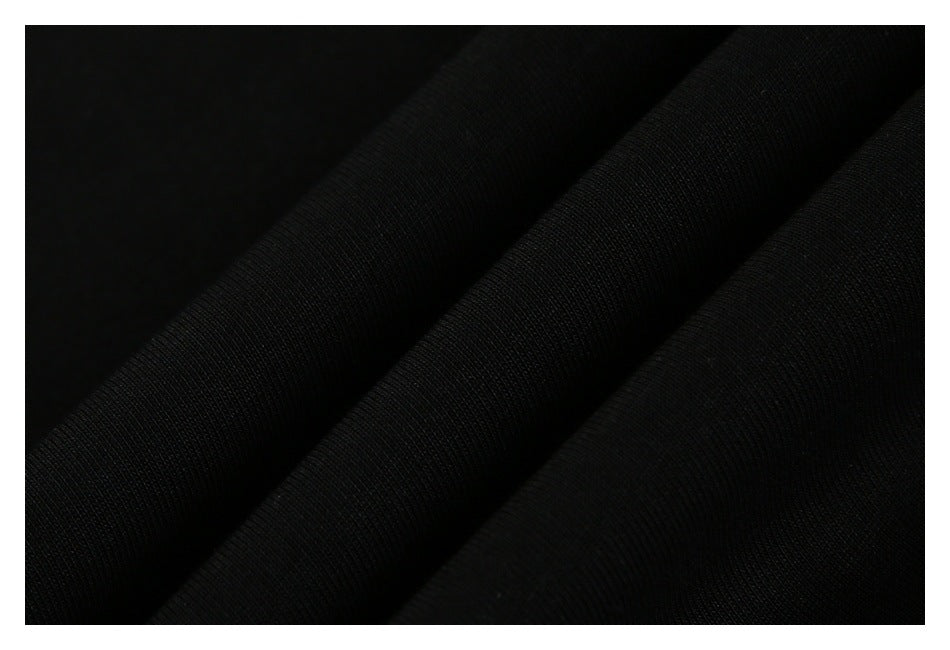 Close-up showing the texture and folds of black fabric.