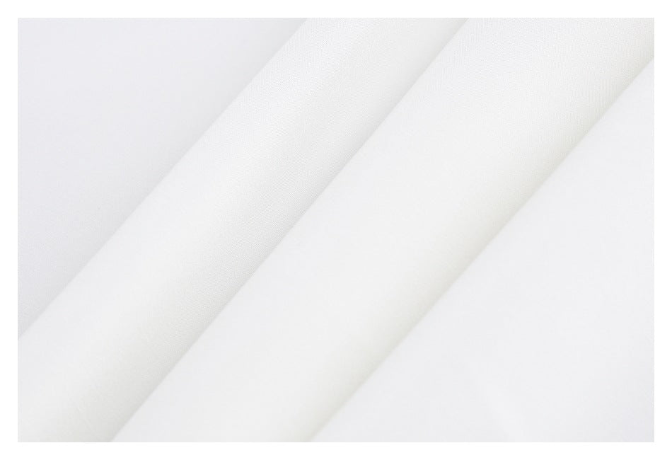 Close-up of smooth white fabric showing its fine surface texture.