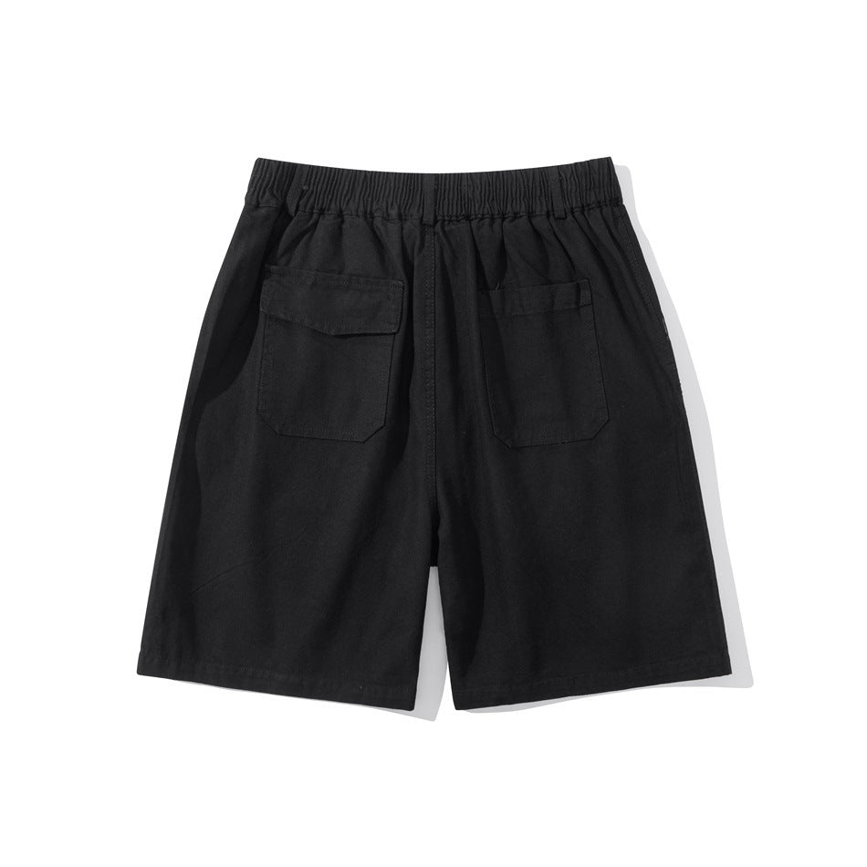 Black shorts shown from the back, with an elastic waistband and two rear pockets.