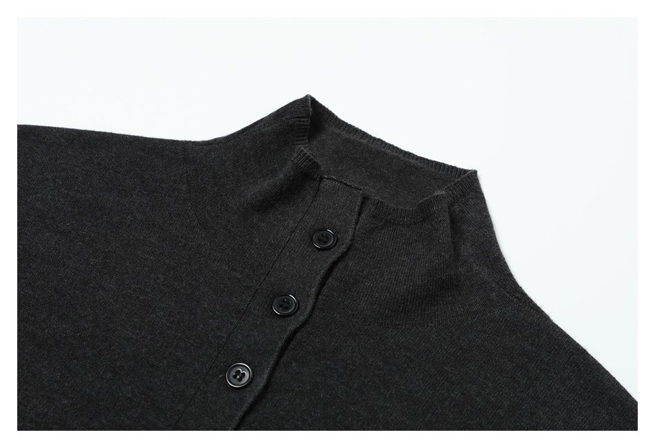 Close-up of a charcoal top's stand collar and three-button placket.