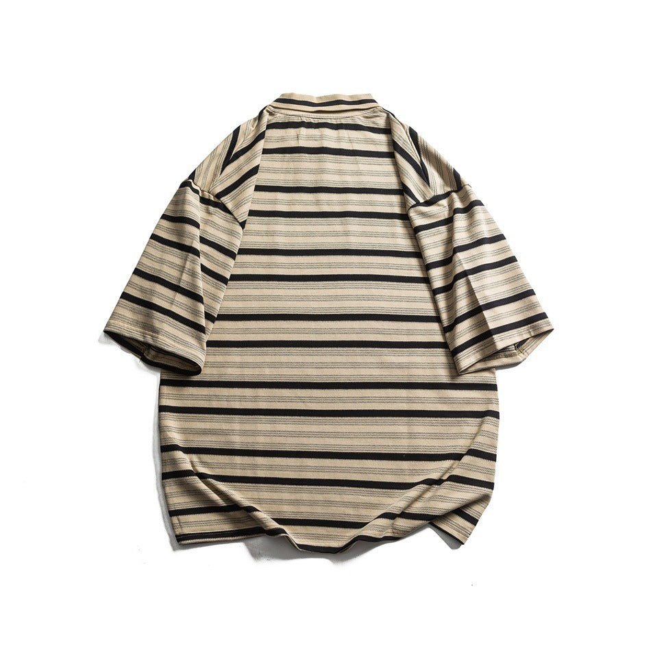 Back view of a beige and black striped oversized collared T-shirt laid flat on a white background.