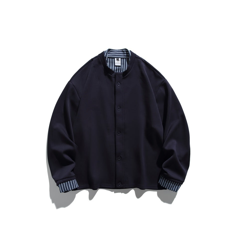 Front view of a navy button-front jacket with a band collar and blue striped lining at the neck and cuffs.