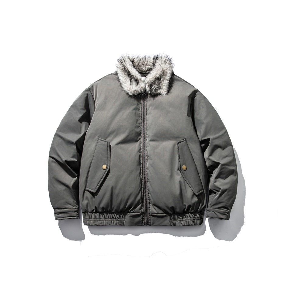 Dark gray bomber-style padded jacket with light fur-textured collar, front zipper, flap pockets and ribbed hem, front view