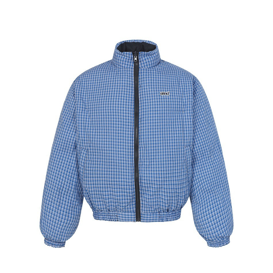 Reverse side of the jacket in blue and white plaid with stand collar, black zipper and elastic hem