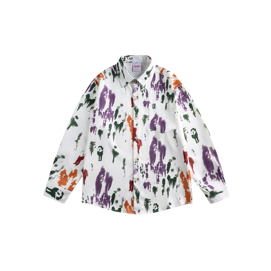 Flat lay of a white long-sleeve button shirt with purple, green, orange and red abstract figure print
