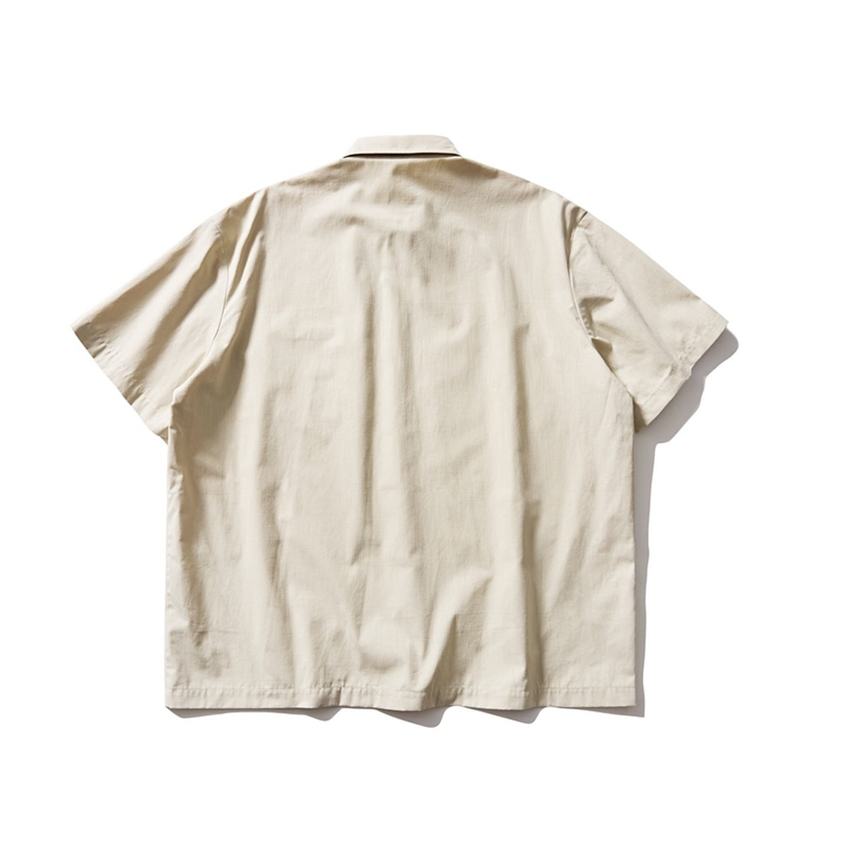 Beige short-sleeve shirt, flat lay back view with plain back panel and collar
