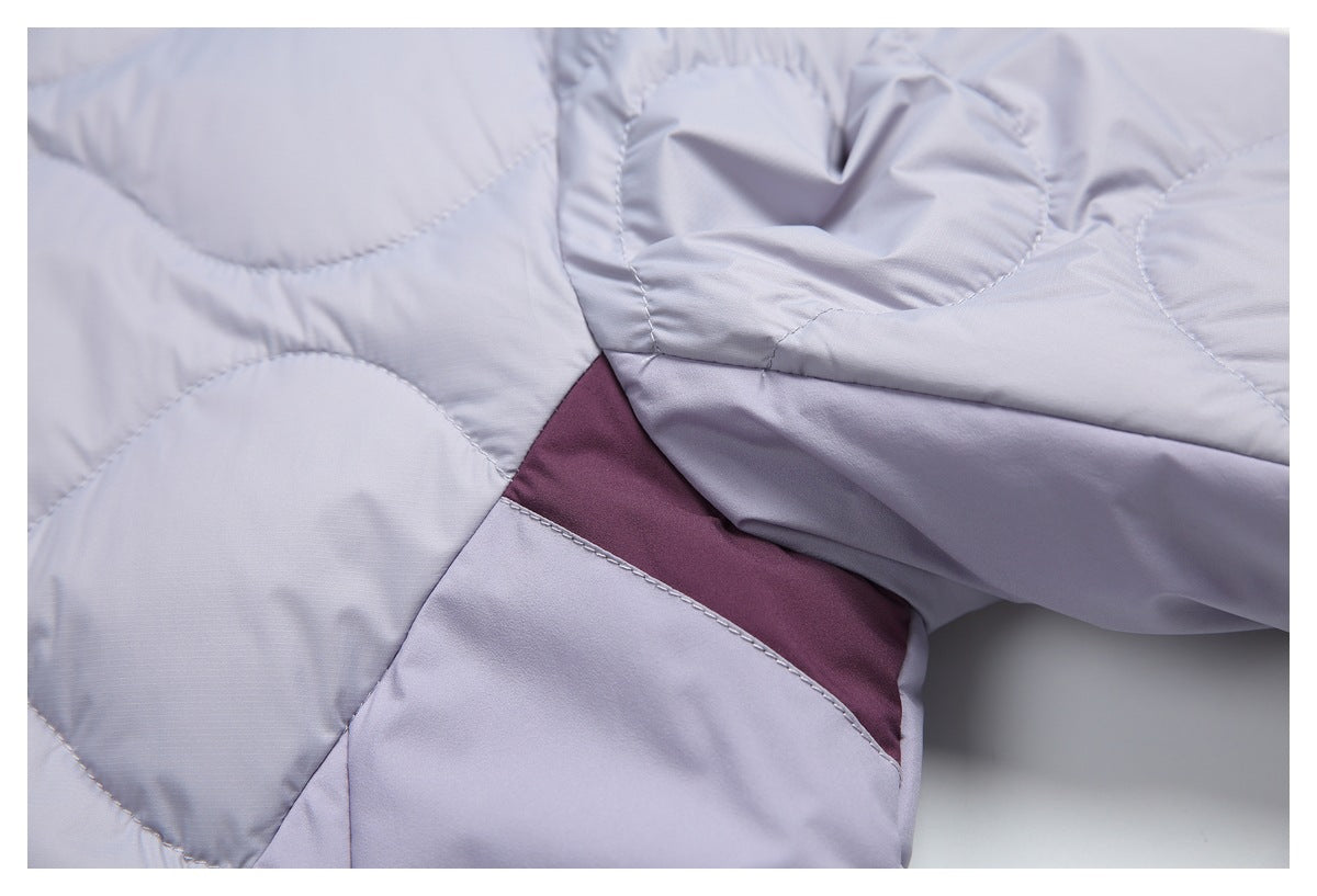 Close-up of lavender quilted panels and a burgundy inset section.