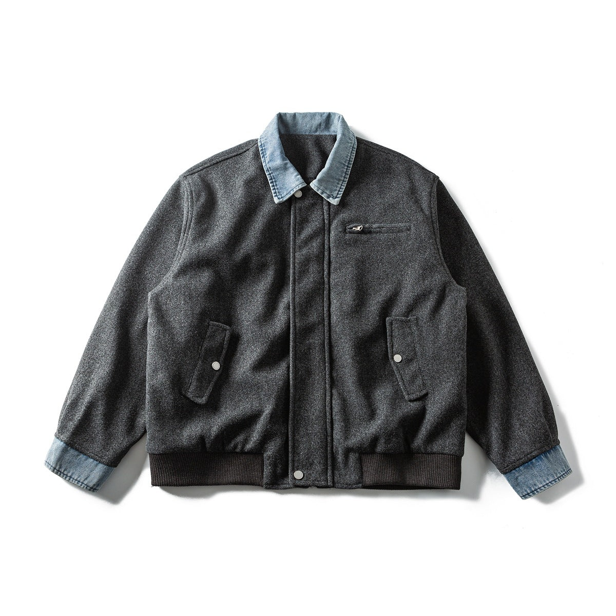 Dark gray felt-like jacket with denim collar and cuffs, front zip, chest zip pocket, snap-flap pockets and ribbed hem