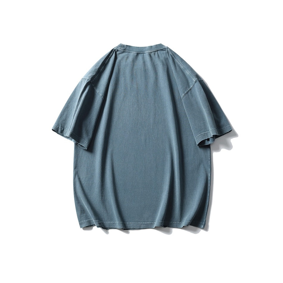 Back view of an oversized slate-blue T-shirt with short sleeves and a plain design.
