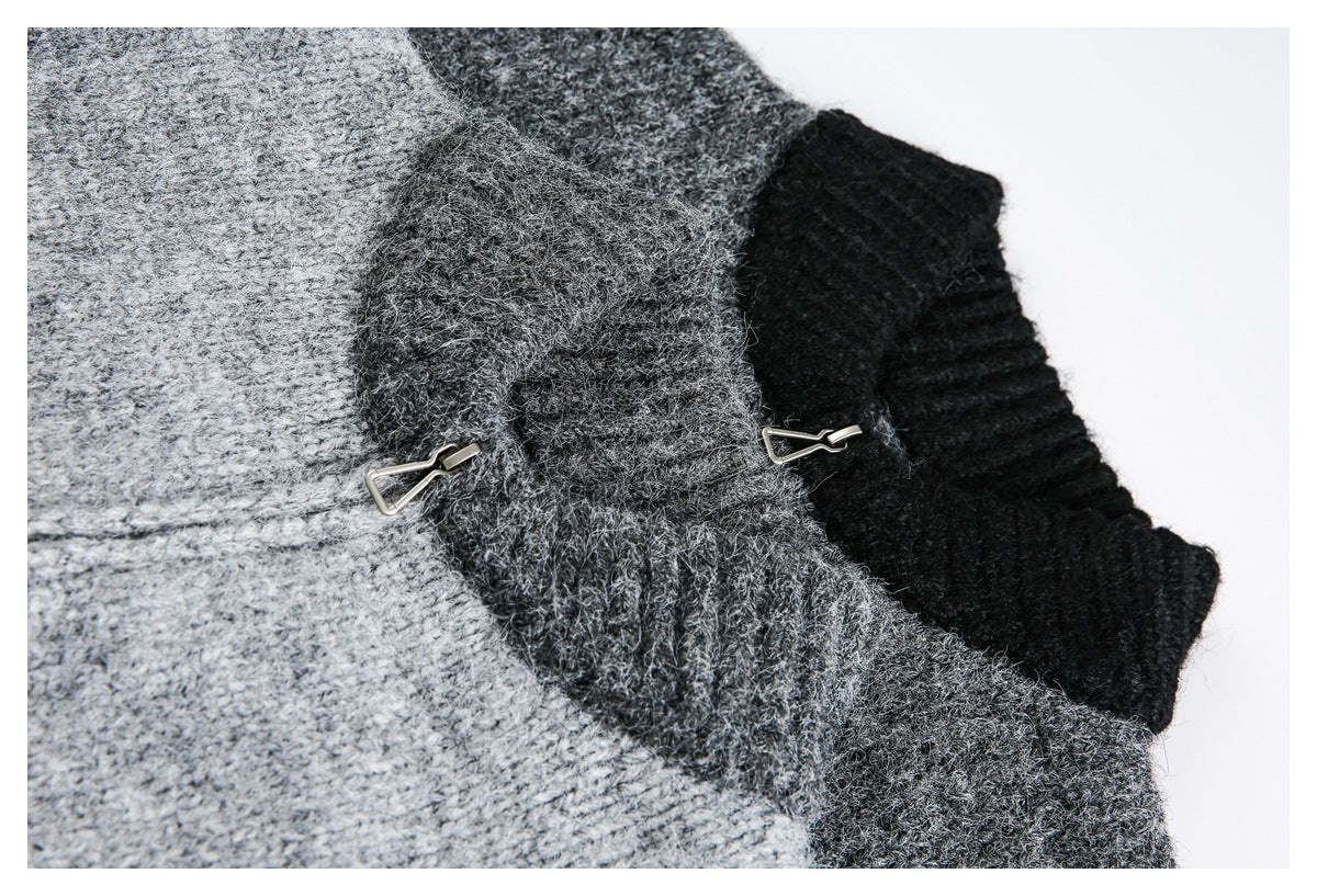 Close-up of the cardigan's textured knit, contrasting ribbed trim and metal zipper pulls.