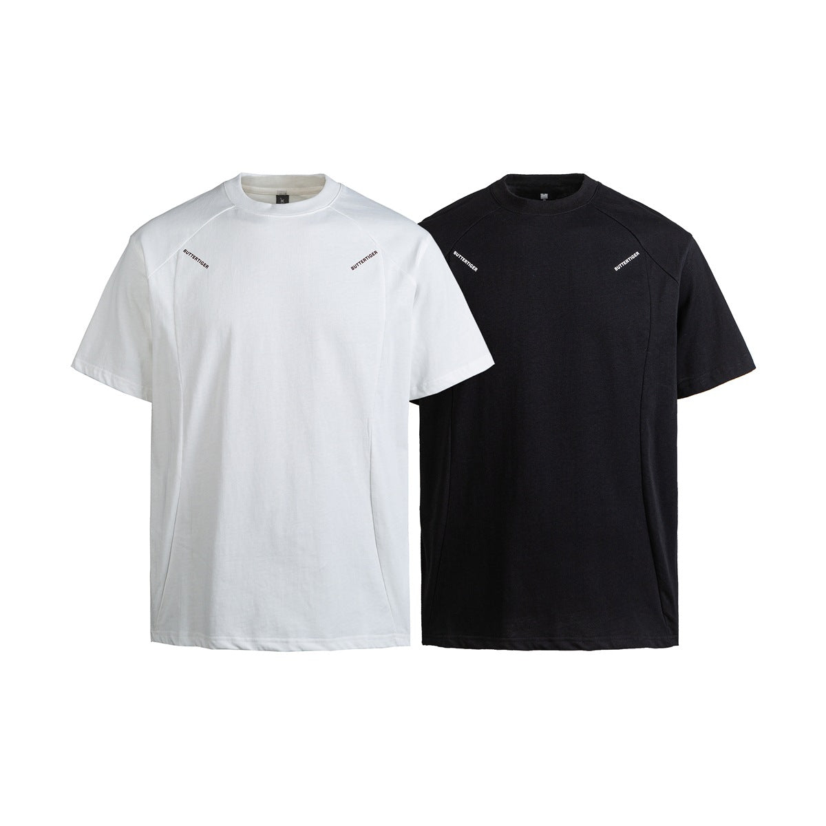 White and black short-sleeve crew-neck T-shirts shown from the front, each with small chest lettering.