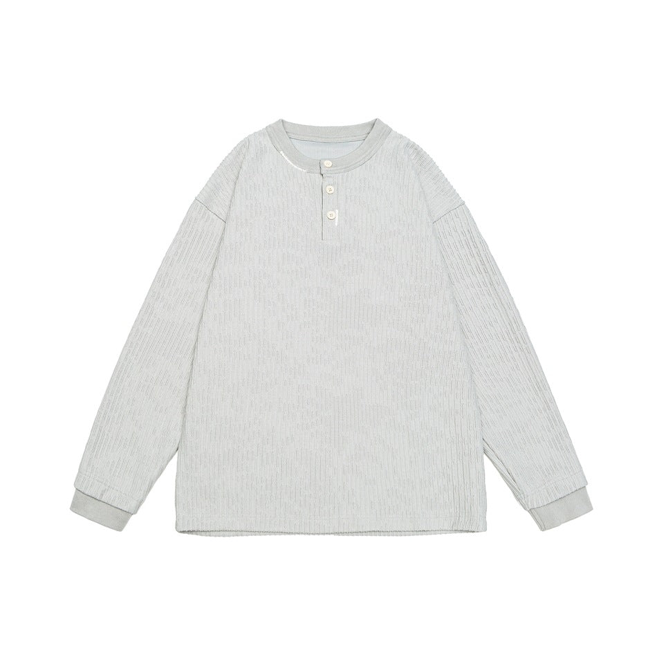 Light gray ribbed long-sleeve Henley top with three buttons and ribbed cuffs, flat lay on white