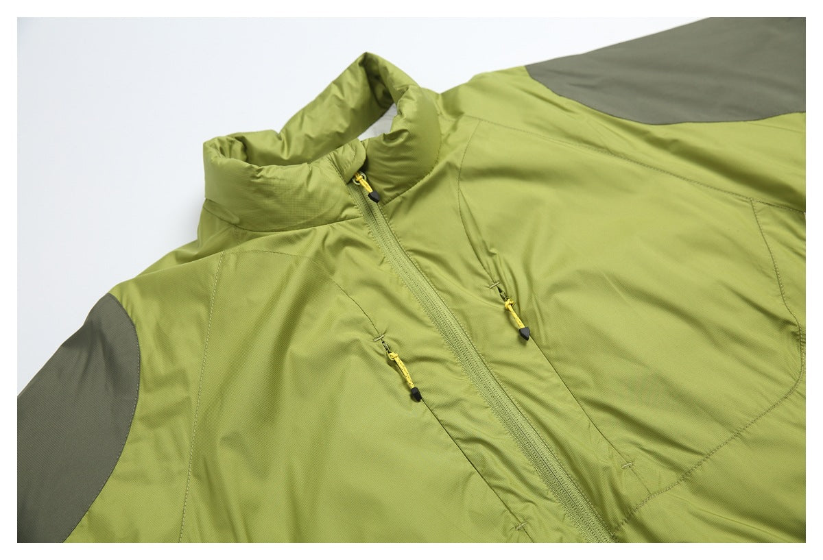 Close-up of a lime-green jacket showing its high collar, front zipper, yellow zipper pulls, and gray shoulder panel.