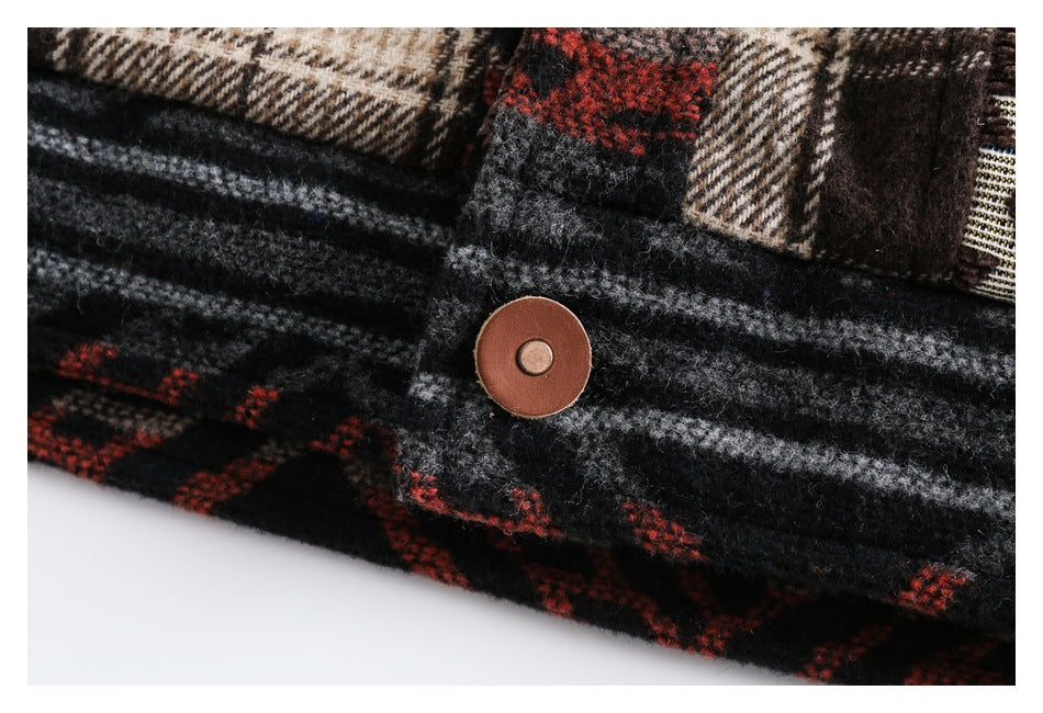 Close-up of a round brown button on black and gray plaid fabric with red accents.