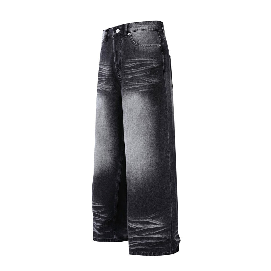 Front view of wide-leg charcoal-black jeans with faded whiskering and washed highlights.