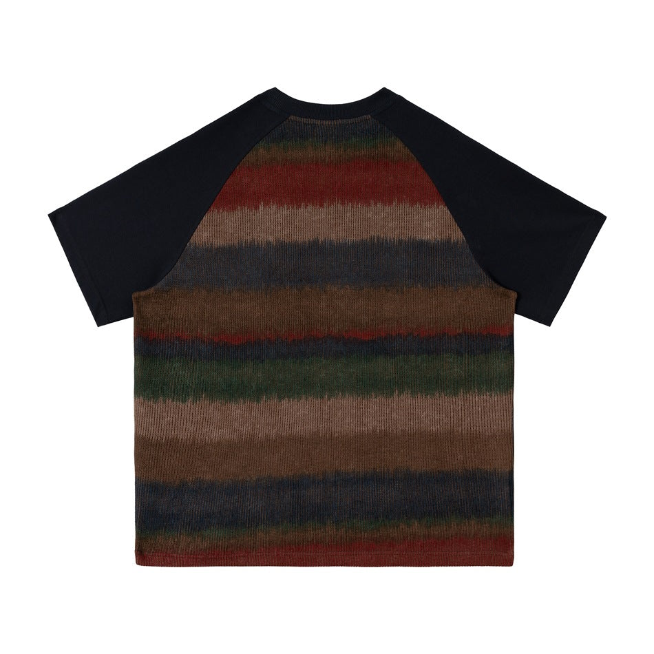 Back view of a short-sleeve raglan shirt with navy sleeves and horizontal muted red, brown, green, and blue stripes.