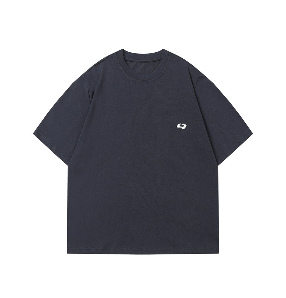 Front view of a dark navy short-sleeve crew-neck T-shirt with a small white chest emblem, shown flat.