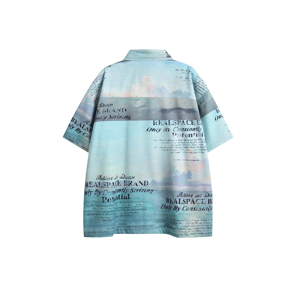 Back view of a light blue short-sleeve shirt with a cloudy landscape print and black English text.