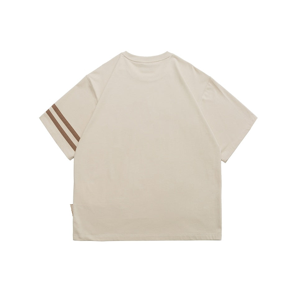 Back view of a cream short-sleeve T-shirt with two brown stripes on one sleeve.