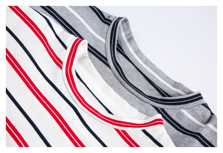 Close-up of two striped shirt necklines: one gray with navy and white stripes, the other white with red and navy stripes.