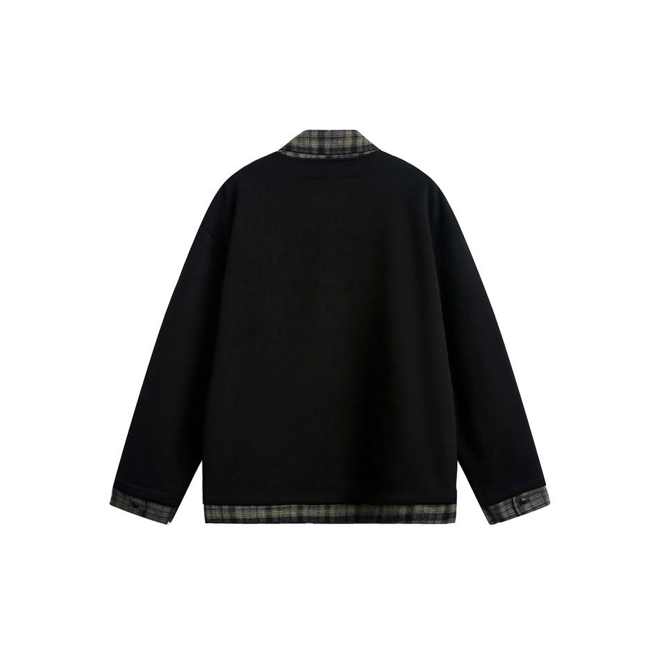 Back view of a black jacket with muted plaid trim at the collar, cuffs, and hem.