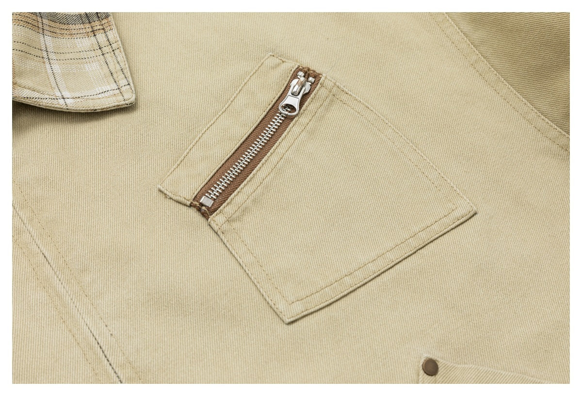 Close-up of a square jacket pocket with a brown-trimmed metal zipper on sand-beige fabric.