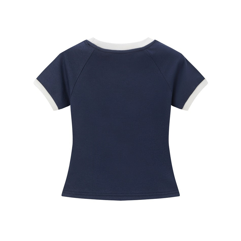 Back view of navy short-sleeve tee with white neck and cuff trim, raglan sleeves and a plain back