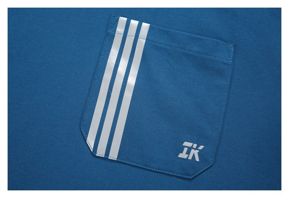 Close-up of a blue garment pocket with three white stripes and a small white emblem.