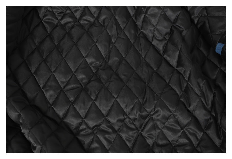 Close-up of the jacket's black diamond-quilted lining.