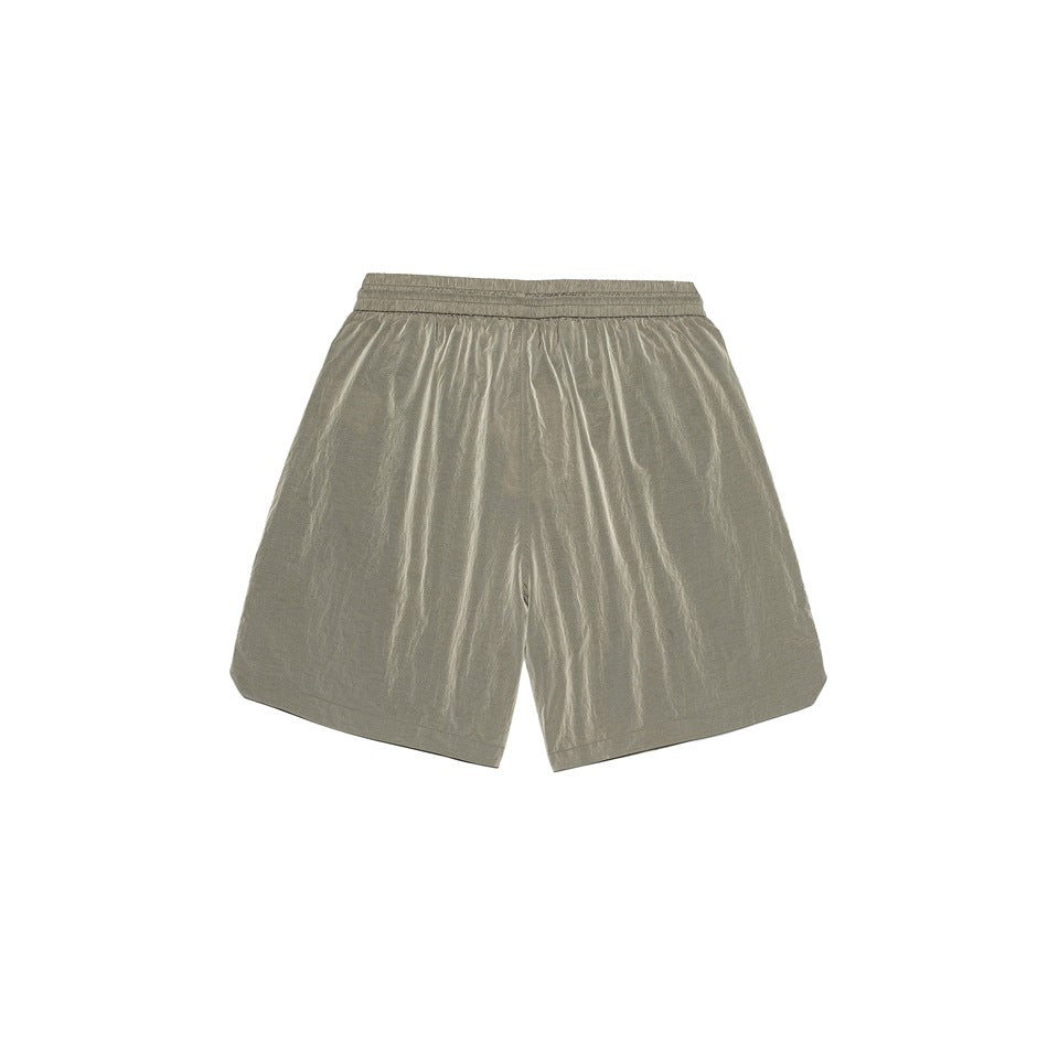 Back view of olive-gray shorts laid flat, with a gathered waistband and wide legs.