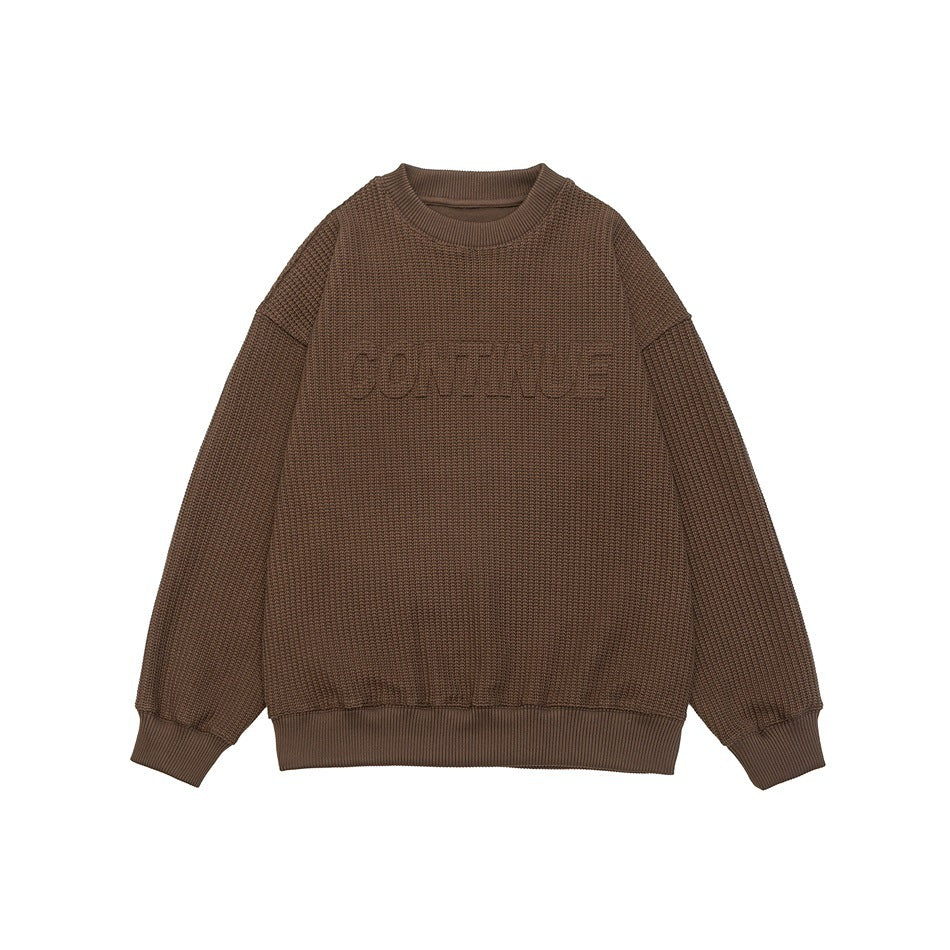 Brown ribbed waffle-knit crewneck sweatshirt with embossed lettering across the chest, flat front view