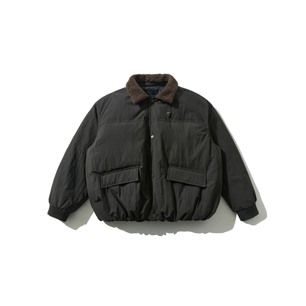 Dark gray padded jacket with brown fleece-like collar, snap front and two flap pockets, flat lay front view