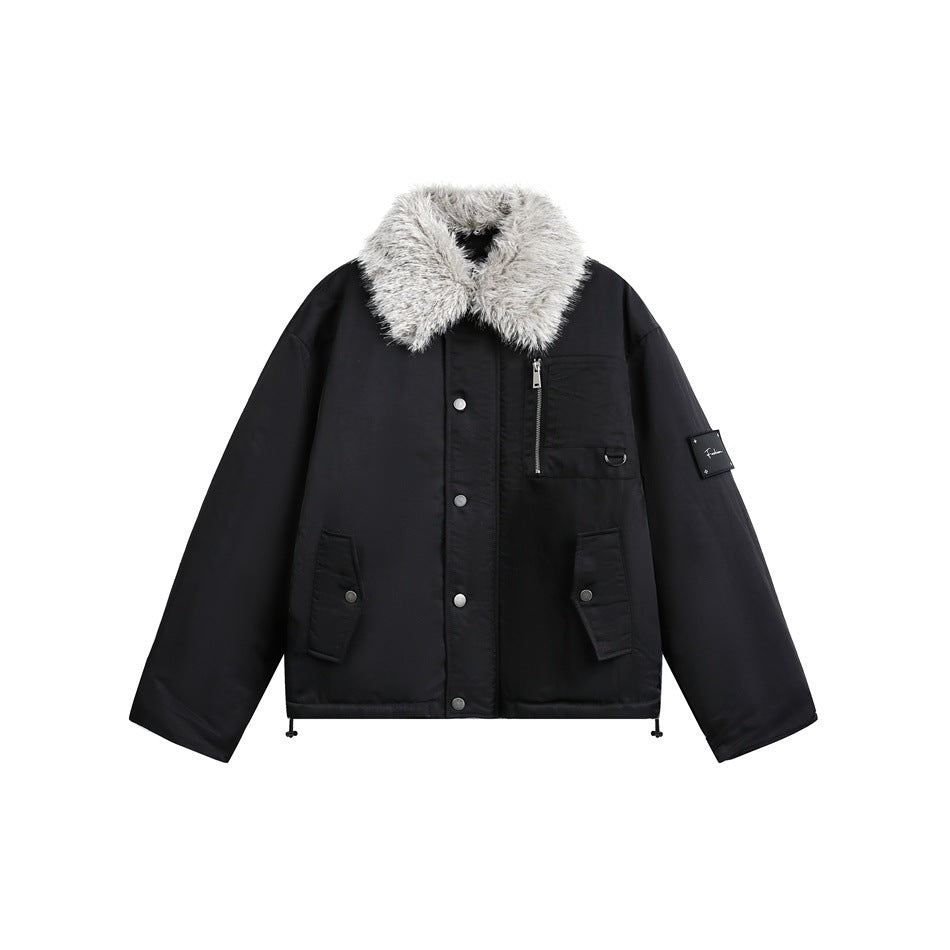 Black snap-front jacket with gray fuzzy collar, chest zip pocket, flap pockets and sleeve patch, flat lay