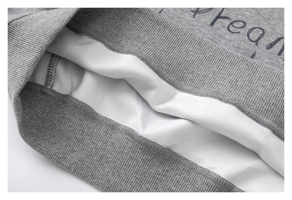 Close-up of the sweatshirt's ribbed hem and interior seam construction.