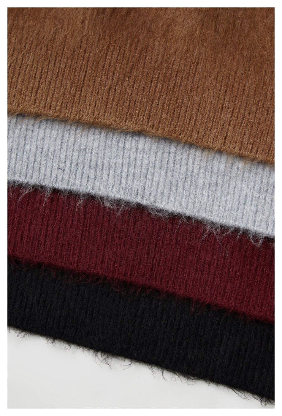 Close-up of fuzzy rib-knit garment edges in brown, light gray, burgundy, and black.
