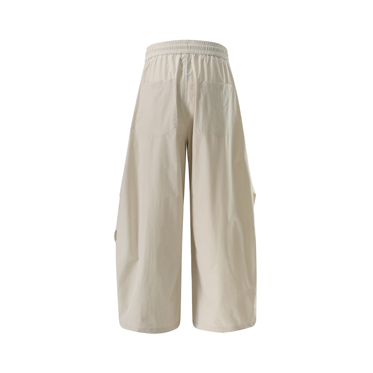 Back view of off-white wide-leg pants with an elastic waistband and two patch pockets.