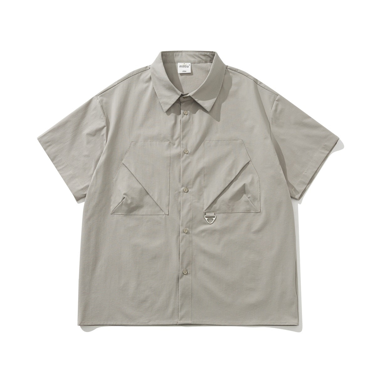 Khaki-gray short-sleeve button-up shirt with two large angled chest pockets and a metal D-ring, flat lay front view