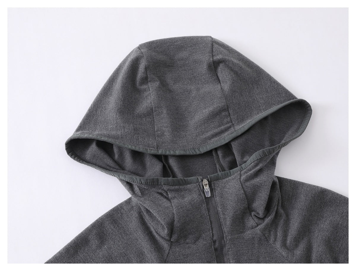 Close-up of a charcoal gray hoodie showing the hood, bound edge, and front zipper.