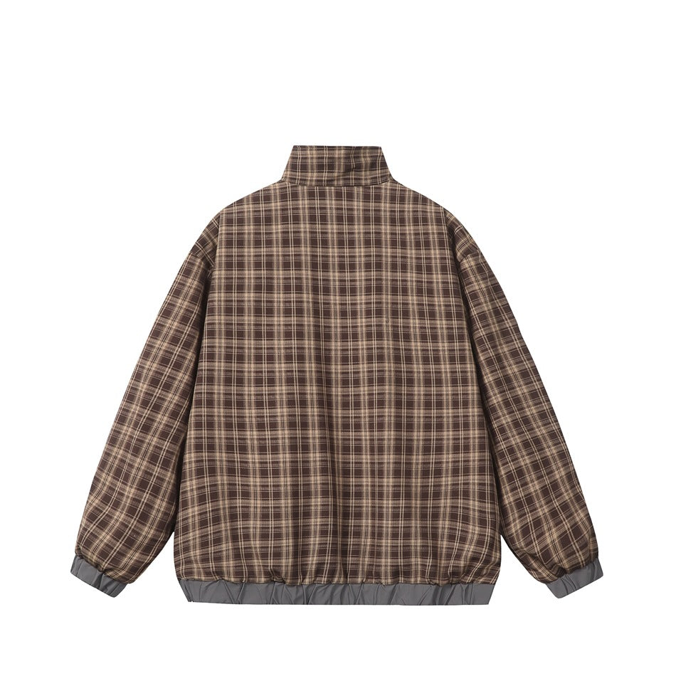 Back view of a brown plaid jacket with a stand collar and gray trim at the cuffs and hem.
