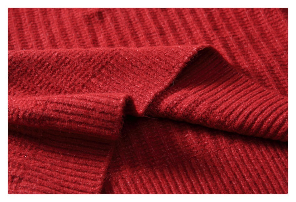 Close-up of overlapping ribbed edges and textured knit on the red garment.