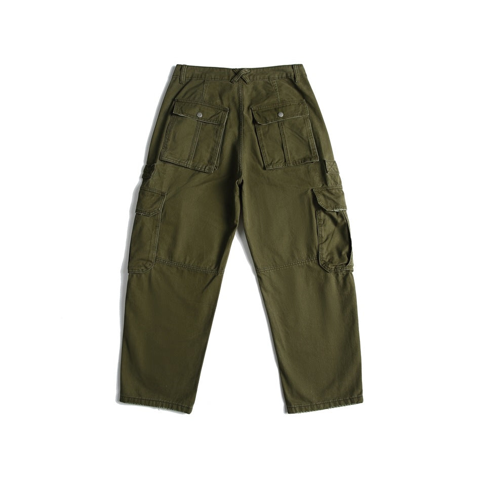 Back view of olive green cargo pants with two buttoned rear pockets and large side cargo pockets.