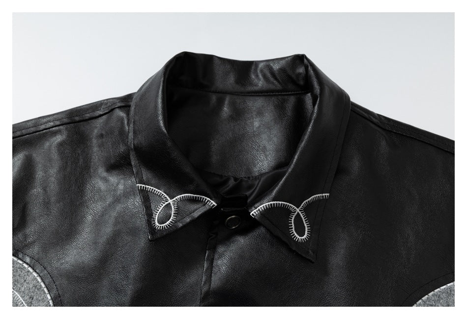 Close-up of the jacket's black pointed collar with white loop stitching and a snap closure.