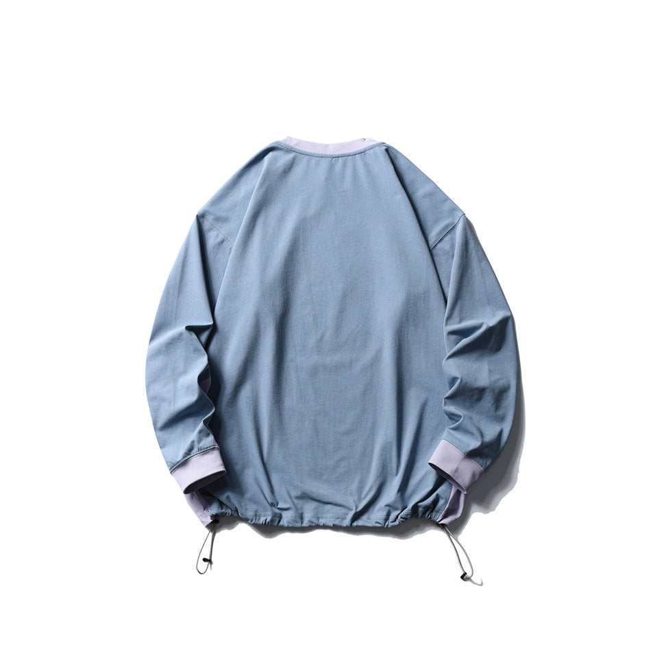 Back view of a blue-gray long-sleeve sweatshirt with lavender neck and cuffs and adjustable drawstrings at the hem.