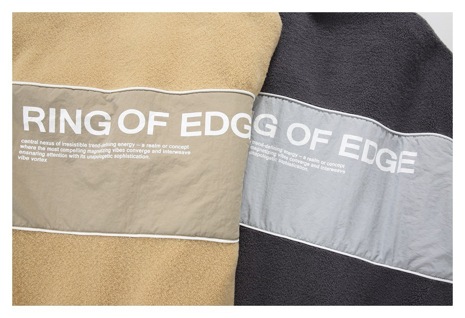 Close-up of tan and charcoal fleece jackets with contrasting light panels and large white text across the chest.