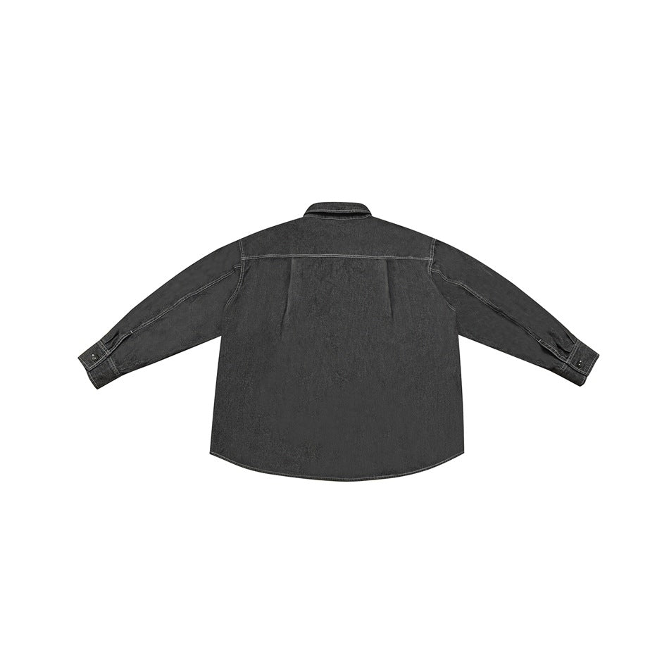 Back view of black-gray denim-look shirt with back yoke, center pleat and buttoned cuffs