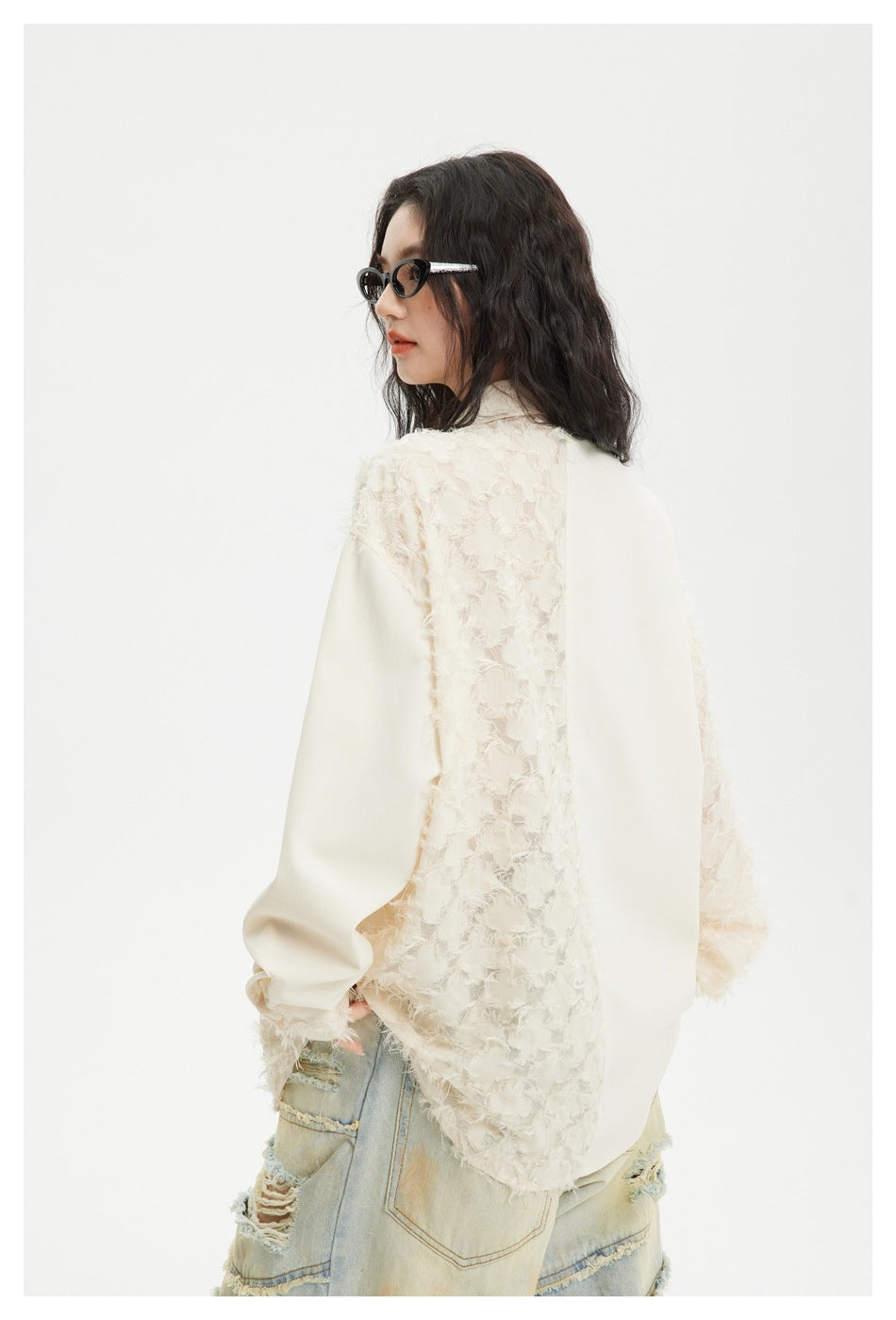 Model wearing an ivory shirt with textured panels and smooth sections, shown from the back at an angle.