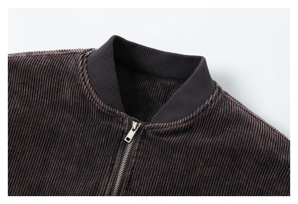 Close-up of the bomber jacket's ribbed collar, textured fabric, and metal front zipper.