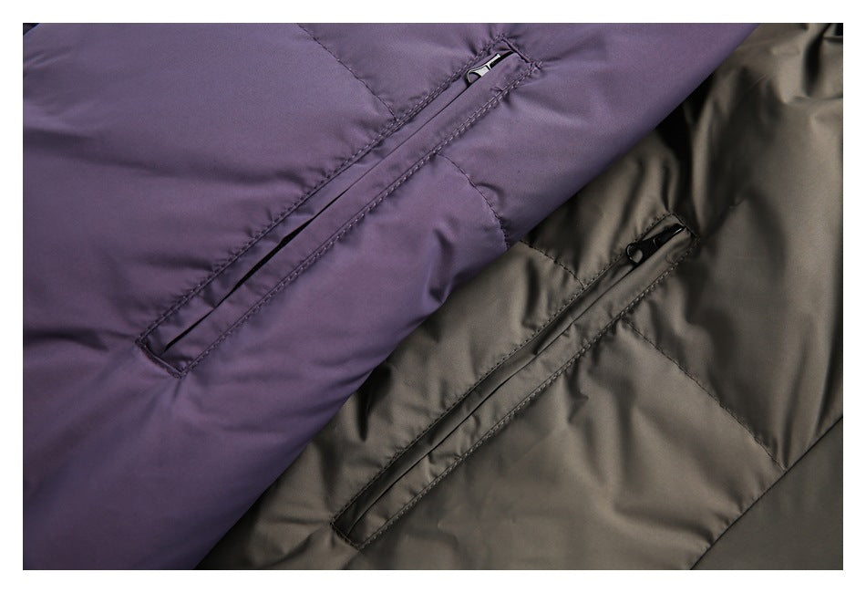 Close-up of diagonal zip pockets on purple and charcoal garments.
