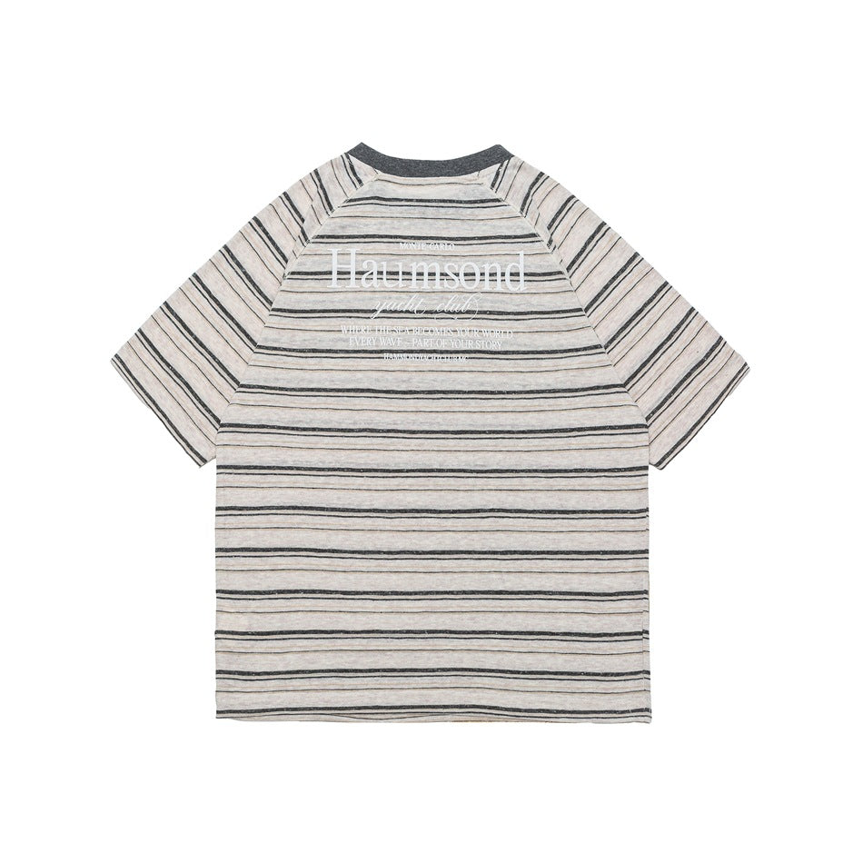Back view of a beige-gray striped raglan T-shirt with dark gray collar and white text print on the upper back
